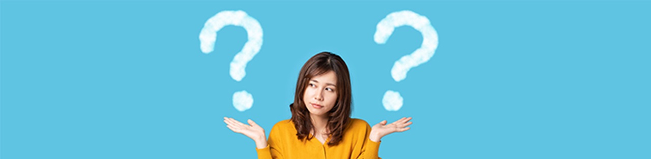 Woman thinking in front of laptop