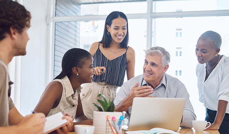 A group of people talking to each other