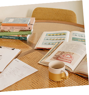 Few books and a cup placed on the table