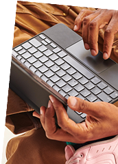 A boy hands on the laptop who is working on it